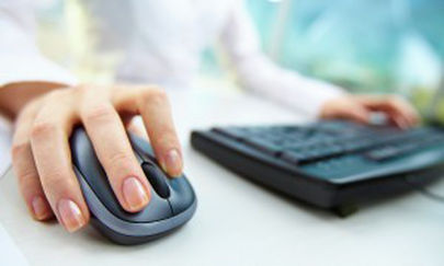 An employee uses a keyboard and mouse.